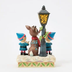 Enesco Jim Shore Rudolph And Elves Caroling Light-Up Figurine, 8.4" 9 Enesco Jim Shore Rudolph And Elves Caroling Light-Up Figurine, 8.4" -Hallmark Rudolph the RedNosed Reindeer LightUp Figurine 6017191 03